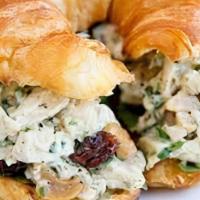 Chicken Salad Croissantwich · with almonds, grapes, onion & lettucs on a freshly baked croissant.