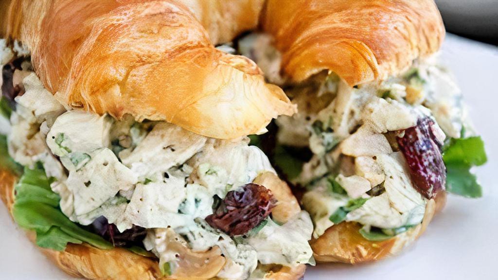 Chicken Salad Croissantwich · with almonds, grapes, onion & lettucs on a freshly baked croissant.