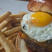 The Spicy Brunch Burger · house made burger, fried egg, tomato jam, jalapenos, cheddar & fries