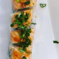 Oregon Roll · Spicy imitation crab, cucumber inside, on top seared salmon, green onions.