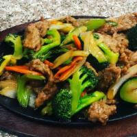 Beef Stir-Fry Vegetable · Tender beef, stir-fry broccoli, zucchini, carrots, onions, served with steamed rice.
