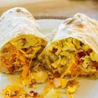 Bacon And Eggs  · Bacon and scramble eggs with cheddar cheese wrapped on a big flour tortilla