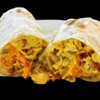 Winnies And Eggs · Winnies and scrambled eggs with cheddar cheese wrapped on a big flour tortilla a hot sauce c...