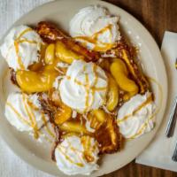 Apple French Toast · Thick egg bread dipped in our famous batter topped with apple compote, whipped cream, and po...