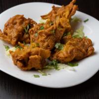 Onion Bhaji  · Thinly sliced onion mixed in chick-pea batter, combination of herbs & Indian spices, fried t...