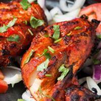 Chicken Tandoori · Half chicken marinated in a mixture of yogurt, garlic, ginger, and other select spices, and ...
