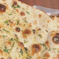 Garlic Naan · Leavened bread of fine flower with a touch of garlic.