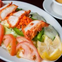 Chicken Tikka Salad · Boneless white chicken roasted in tandoor & served with fresh salad & a yogurt based Indian ...
