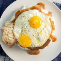 Loco Moco Plate · Hand crafted all beef patty that's served on a bed of rice with choice of salad, two large e...