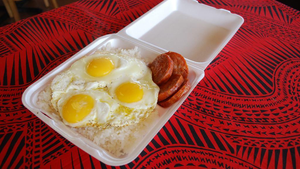 Portuguese Sausage And Eggs · Six slices of grill Portuguese sausage with three large eggs and rice.