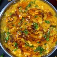 Dal Tadka / Andhra Dal · Yellow lentil tempered in butter with onions and tomatoes.