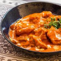 Butter Chicken · we cook boneless tandoor grilled chicken pieces in rich flavored creamy tomato sauce. Contai...