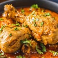 Andhra Chicken Curry · Chicken with bones finished with Homemade curry sauce.