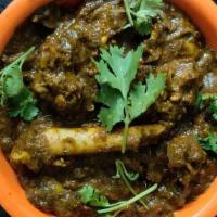 Guntur Gongura Mutton · Andhra style goat cooked in gongura sauce.