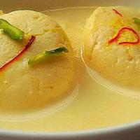 Saffron Rasmalai · Juicy cheese balls soaked in creamy milk.