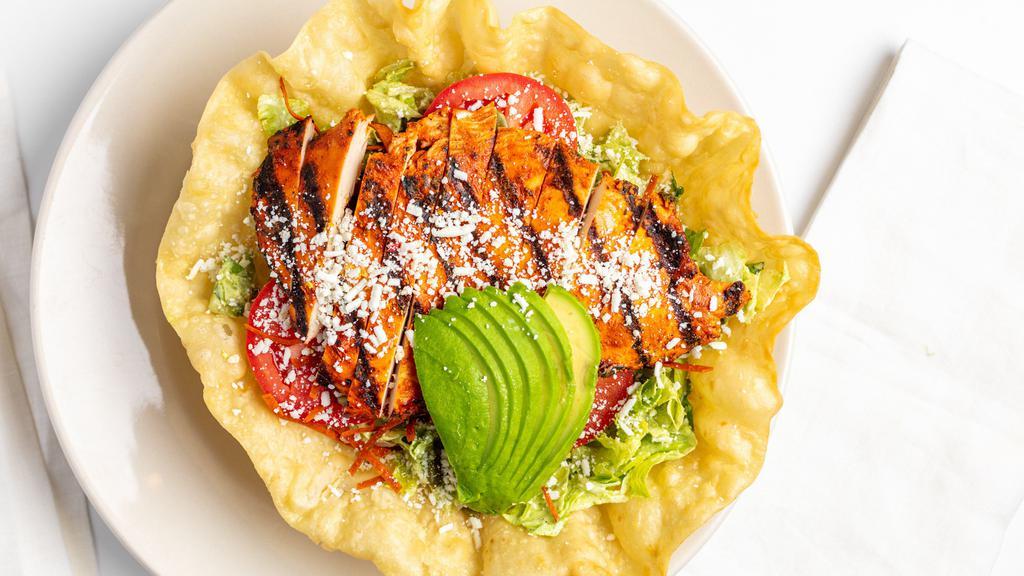 Chicken & Avocado Salad · Marinated grilled chicken breast, romaine lettuce, tomatoes, cotija cheese, pepita seeds, tortilla strips and cilantro house dressing topped with avocado.