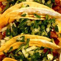 Street Tacos · Five soft corn tortilla, with your choice of pastor, steak, carnitas or chicken. Topped with...