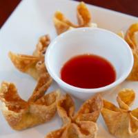 Crab Cream Cheese / Banh Cua Chien (6 Pieces) · The wontons are stuffed with real crab meat, cream cheese, and cooked golden. Served sweet a...