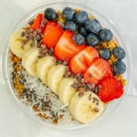 Bloom Bowl · Blended: Acai, Strawberry, Banana, Blueberry, Almond Milk, and Mango.

Topped: Banana, Blueb...