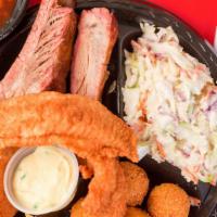 Rib & Fish Combo Dinner · Two ribs and hand-breaded fish, served with your choice of two side dishes, hush puppies, ta...