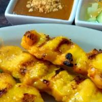 Grilled Chicken Satay (4 Pcs) · BBQ grilled marinated strips of the tender meat fillet served with Thai peanut sauce and cuc...