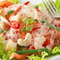 Glass Noodles Salad · Glass noodles, ground meat mixed with lime juice, cilantro, onion, tomatoes and cucumber, pe...