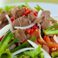 Thai Beef Salad · Grilled thinly sliced lean tender beef, mint leaves, tomato, cucumber, onion, Thai chili and...