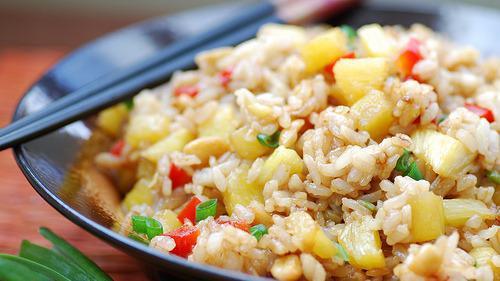 Heavenly Pineapple Fried Rice · Vegan and gluten-free. This classic Thai pineapple fried rice recipe is real vegetarian Thai food. Jasmine rice is fried up with chunks of pineapple, plus cashews, peas and currants with a curry-flavored sauce.