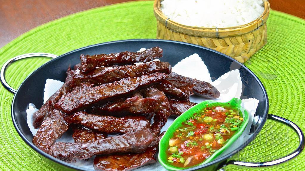 Thai Beef Jerky W/ Sticky Rice · Deep - fried marinated beef serving with sticky rice