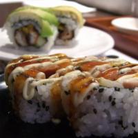 Utah Roll · Spicy yellowtail, salmon, cucumber topped with tempura flake and sesame seeds.