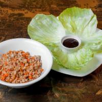 Lettuce Wraps · Wok-seared chicken, bamboo, water chestnuts, onions, and carrots. Served with crisp lettuce ...