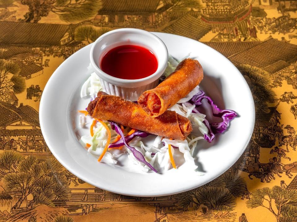 Bacon Shrimp Spring Rolls (2) · Black pepper, sesame oil, shrimp, and bacon wrapped in spring roll skin and fried crispy. Served with sweet and sour sauce.