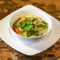 Green Curry · Bamboo, bell peppers, and basil simmered with coconut milk in fresh green chili, wild ginger...
