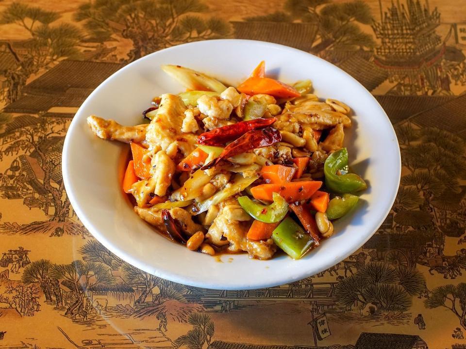Kung Pao · Peanuts, bell peppers, carrots, celery, and Tianjin chilis stir-fried in a spicy soy reduction.