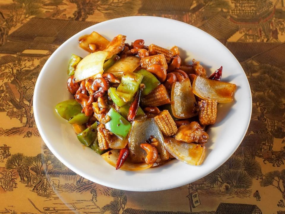 Thai Spicy Cashew · Bell peppers, onions, baby corn, Tianjin chilis, and cashews stir-fried in a spicy Thai soy reduction.