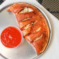 Gorgonzola Guru Calzone · Homemade marinara, ricotta cheese, mozzarella cheese, Gorgonzola cheese, capers, artichoke h...