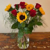 Lucy Arrangement  · Roses and sunflowers with fluffy green foliage 


Please let us know what message you need d...