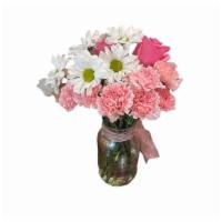 Pretty In Pink  · A beautiful and playful arrangement made with pink roses and white daisies