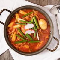 Tteokbokki (Serves 2) · Spicy Korean stir-fried rice cakes with mixed vegetables (onion, cabbage, carrots, and green...