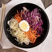 Jjolmyeon · Chewy wheat noodles mixed with carrots, cabbage, sesame seeds and an egg.