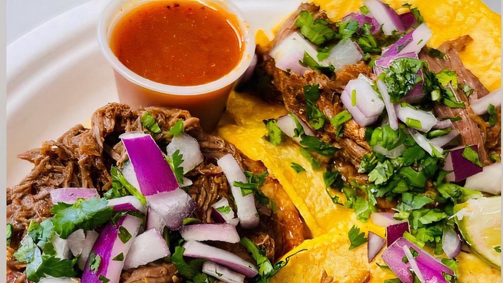 Birria Tacos With Consume( 4 Tacos) · Birria with Corn tortillas. Comes with red onions and Cilantro with Consume (Dipping Sauce). Choice of (Red) Hot sauce, Green avocado sauce (Hot) or (Mild) Green sauce.
