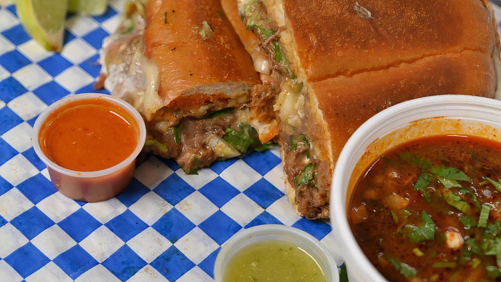 Birria Torta · Sliced Torta Bread, Grilled Mozzarella  Cheese, Cilantro and red onions, Beans, Sour cream, Guacamole. Comes with  A side of Consume (dipping sauce.)