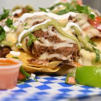 Guerrero Nachos  · Bed of home made nacho chips with a dash of salt. Along with a portion of beans, choice of m...