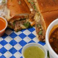 Torta  · Sliced torta bread toasted , with the choice of Asada & Chicken. Comes with red onions cilan...