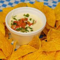 Side Of Chips And Queso · Home made chips alongside our home made Queso!