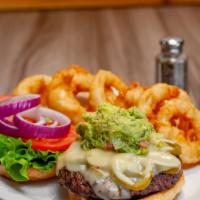 Caliente Burger (1/2 Lb) · Pickled jalapeños, pepper jack cheese, guacamole, lettuce, tomato, and red onion on a brioch...