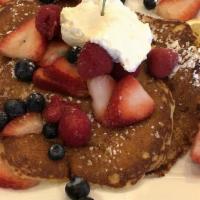 Lemon Ricotta Pancakes · Three lemon ricotta pancakes - topped with blueberries, raspberries, strawberries & homemade...