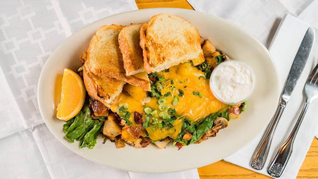 Veggie Skillet · Grilled red potatoes, broccoli, tomatoes, spinach, mushrooms, onions & zucchini - topped with Tillamook cheddar cheese, sour cream & green onions.