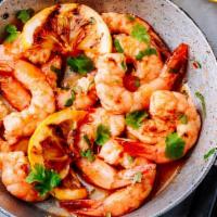 Camarones Mexicanos · Delicious fresh prawns sautéed in butter with wine, spices, mushrooms, tomato, onions, and b...