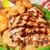 Chicken & Shrimp Fajitas · Delicious marinated shrimp and juicy chicken sautéed with bell peppers and onions, served on...